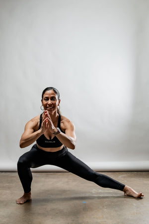 Black women's Soho full-length high waist leggings by Hot Trend Vault, shown on a model with a close-up view of the fabric.