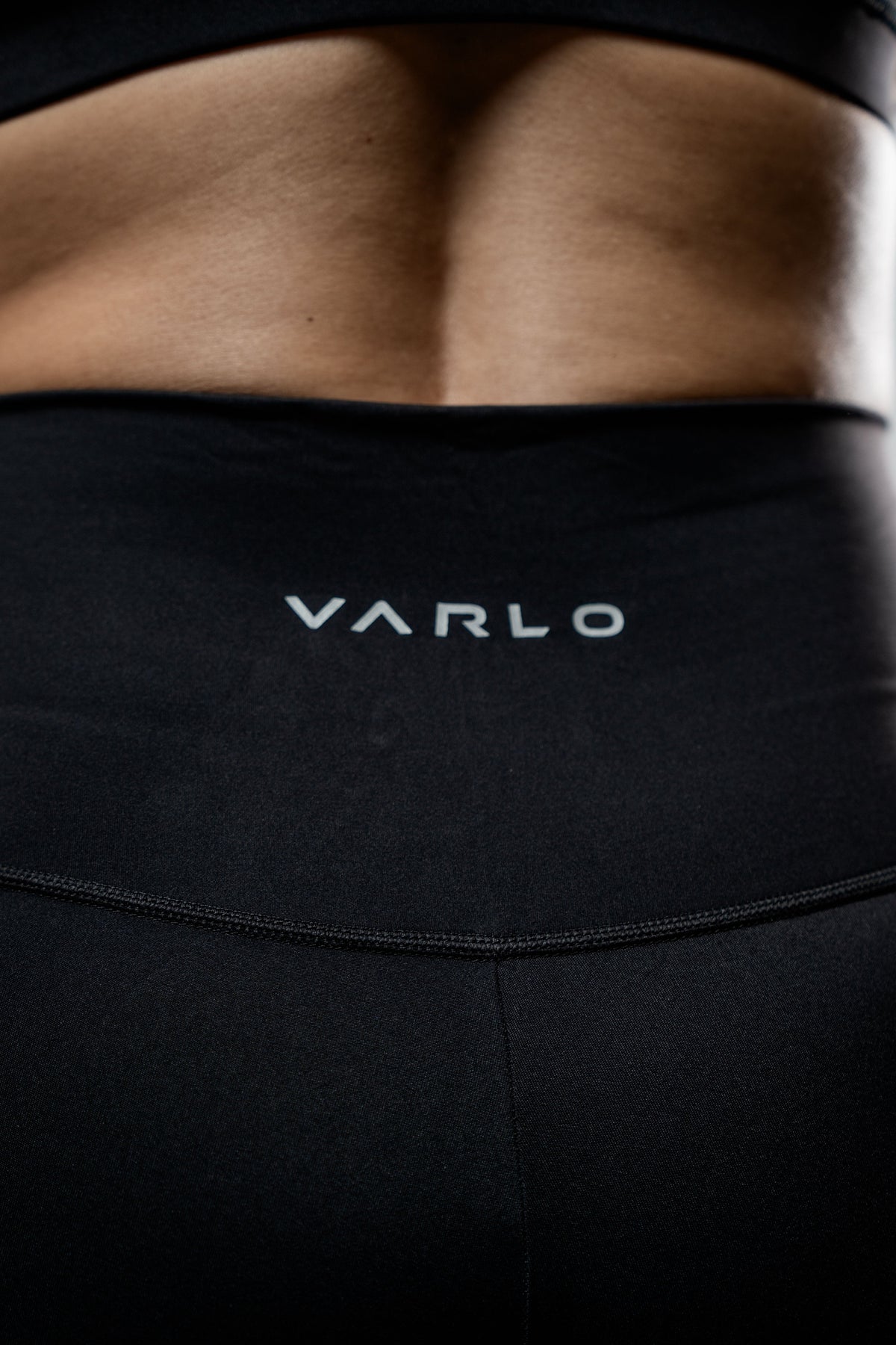 Black women's Soho full-length high waist leggings by Hot Trend Vault, shown on a model with a close-up view of the fabric.
