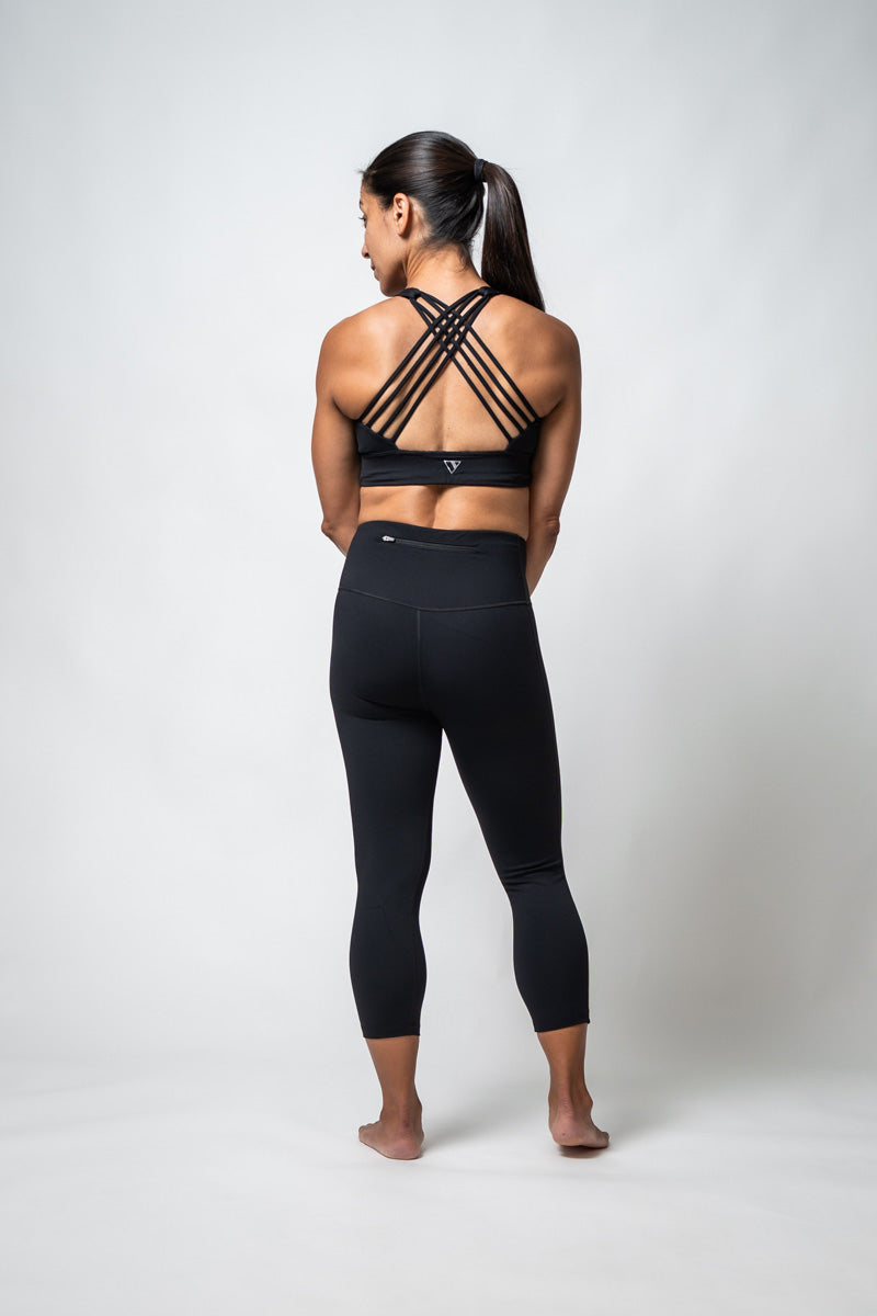Black SOHO women's three-quarter length technical leggings by Hot Trend Vault, showing fitted design and flexible fabric.