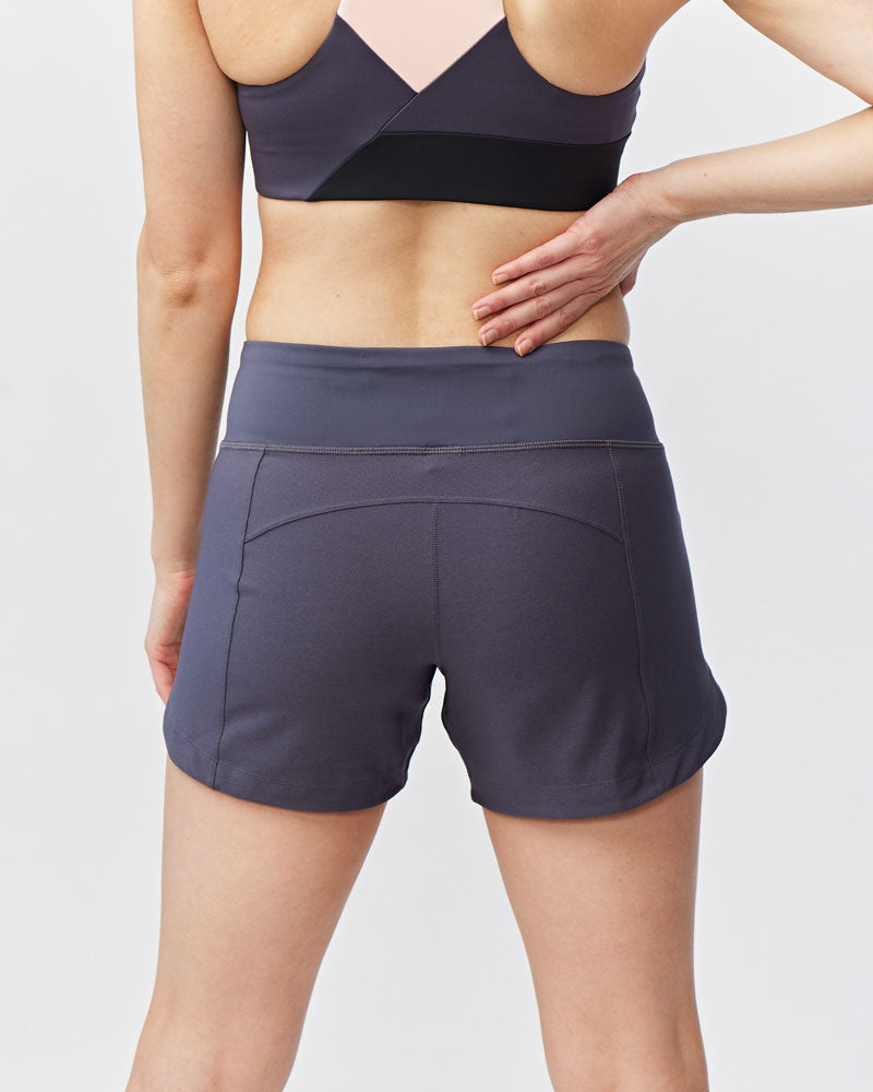 Excel women's workout shorts from Hot Trend Vault in carbon color, designed for extra coverage during sprints and training.