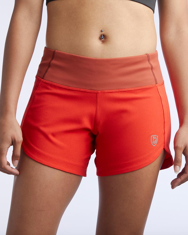 Excel Women's workout shorts in cinnabar red with extra coverage, designed for active training and running by Hot Trend Vault.