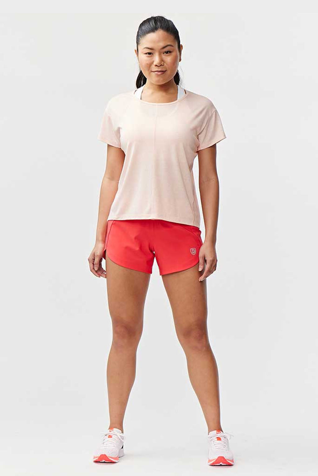 Hot Trend Vault Excel women's workout shorts in coral nectar with extra coverage, designed for comfort during sprints.