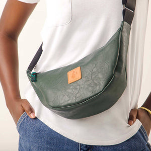 Green round mini vegan leather shoulder bag with Kenyan fabric lining, stylish Ecodunia crossbody purse.
