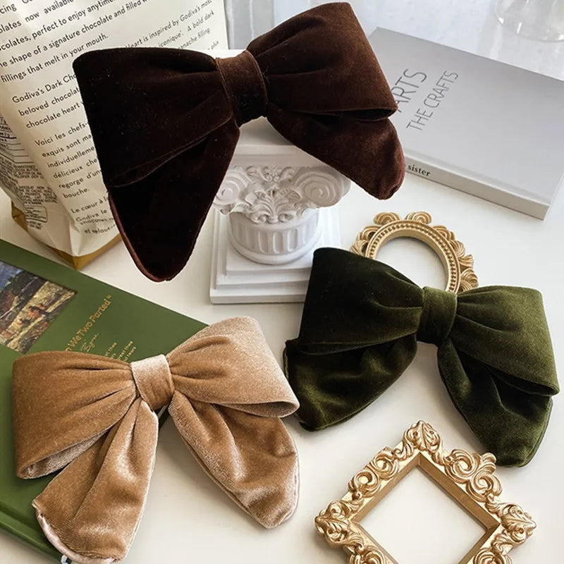 Velvet hair clips with three-dimensional bowknot design for women and girls, elegant accessory by Hot Trend Vault.