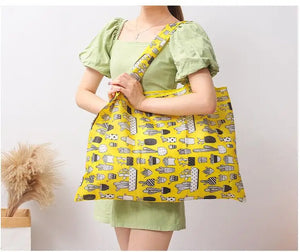 Reusable foldable shopping bag by Hot Trend Vault, large eco-friendly tote with sturdy handles and washable fabric for women.