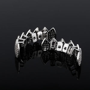 Iced Out CZ grillz set for men and women, gold-plated top and bottom teeth jewelry by Hot Trend Vault, featuring sparkling stones.