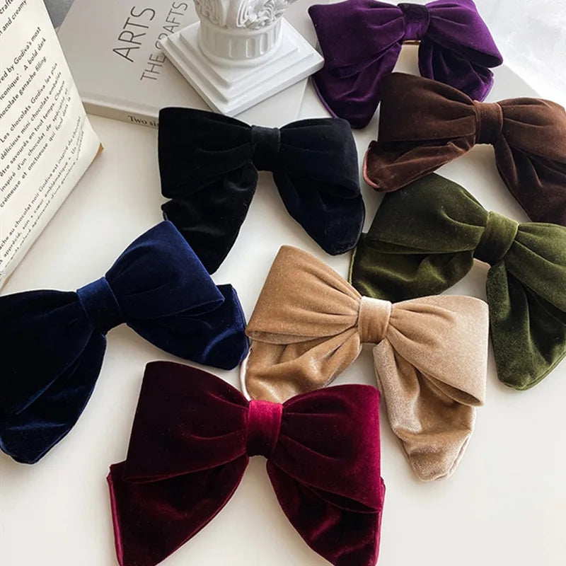 Velvet hair clips with three-dimensional bowknot design for women and girls, elegant accessory by Hot Trend Vault.