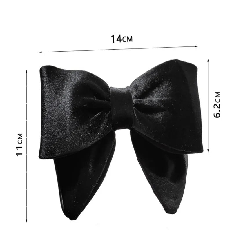 Elegant velvet hair clips with three-dimensional bowknot design for women and girls by Hot Trend Vault.