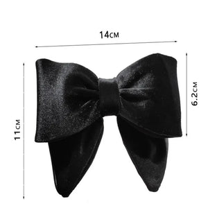 Elegant velvet hair clips with three-dimensional bowknot design for women and girls by Hot Trend Vault.
