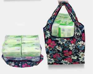 Reusable foldable shopping bag for women by Hot Trend Vault, large tote, eco-friendly, washable, heavy-duty, and foldable design.