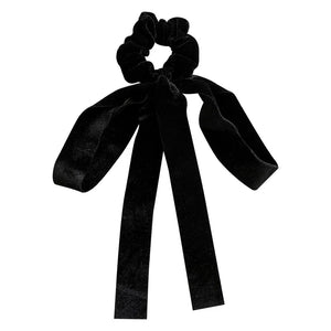 Velvet bow scrunchie hair tie by Hot Trend Vault, soft elastic accessory for women and girls, with a stylish velvet bow detail.