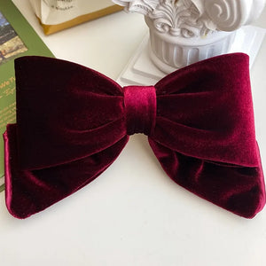 Velvet hair clips with three-dimensional bowknot design by Hot Trend Vault for women and girls.
