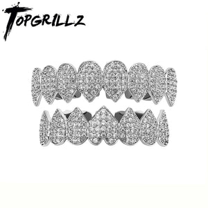 Iced Out CZ grillz teeth set in 14K gold plating for men and women, featuring top and bottom dental jewelry by Hot Trend Vault.