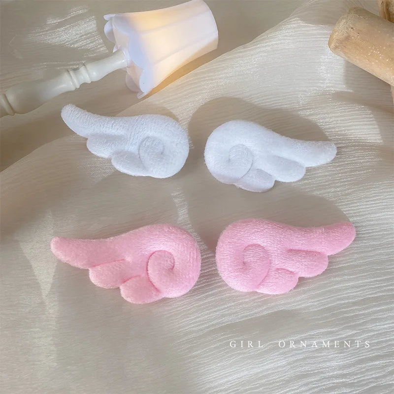Pair of cute plush hair clips for girls and kids from Hot Trend Vault, featuring colorful, soft fabric designs.