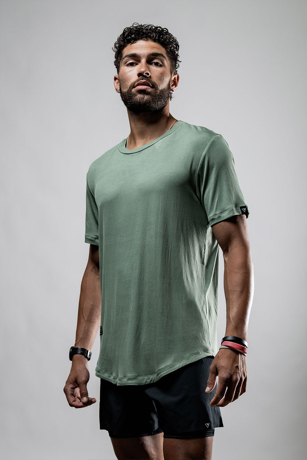 Men wearing Hot Trend Vault Terra Tee shirt in Ironwood, moisture-wicking and odor-resistant bamboo fabric, casual everyday style.