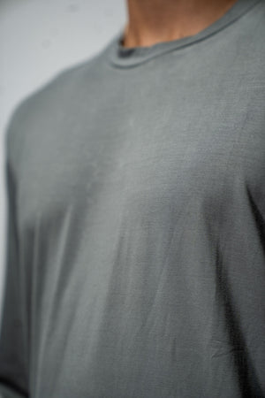 Men's Terra Recovery Field Shirt in stone gray, long sleeve crewneck by Hot Trend Vault, shown in a casual outdoor setting.