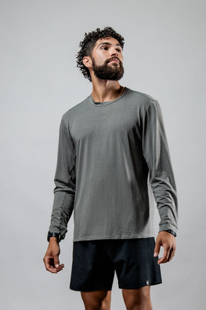 Men's Terra Recovery Field Shirt in stone gray, long sleeve crewneck by Hot Trend Vault, shown in a casual outdoor setting.