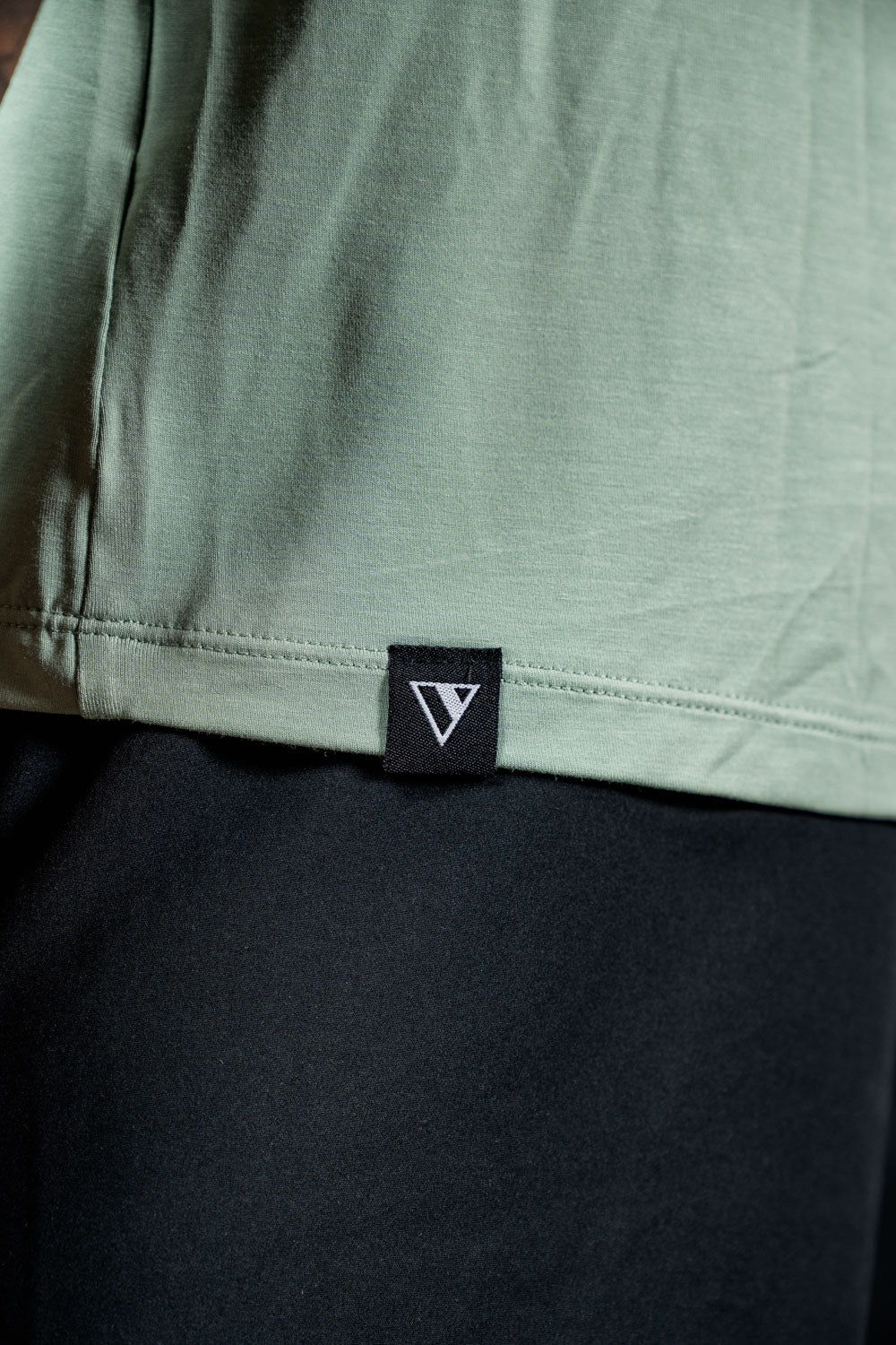 Men's Terra Recovery Polo by Hot Trend Vault in low light olive, showcasing a comfortable polo shirt with a classic fit and subtle branding.