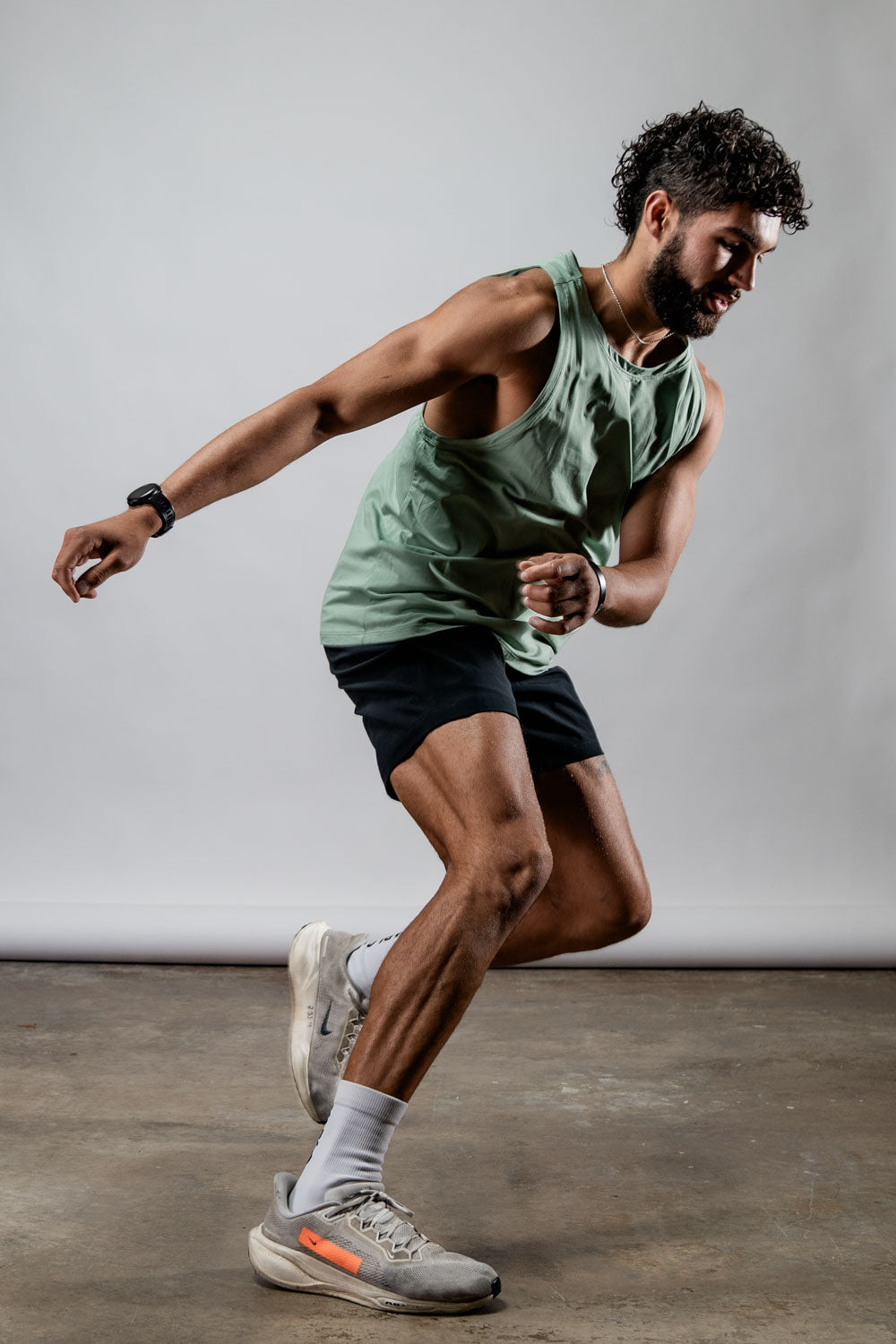 Men's olive green Terra Recovery Tank top by Hot Trend Vault, featuring a low-light, casual design for everyday movement.