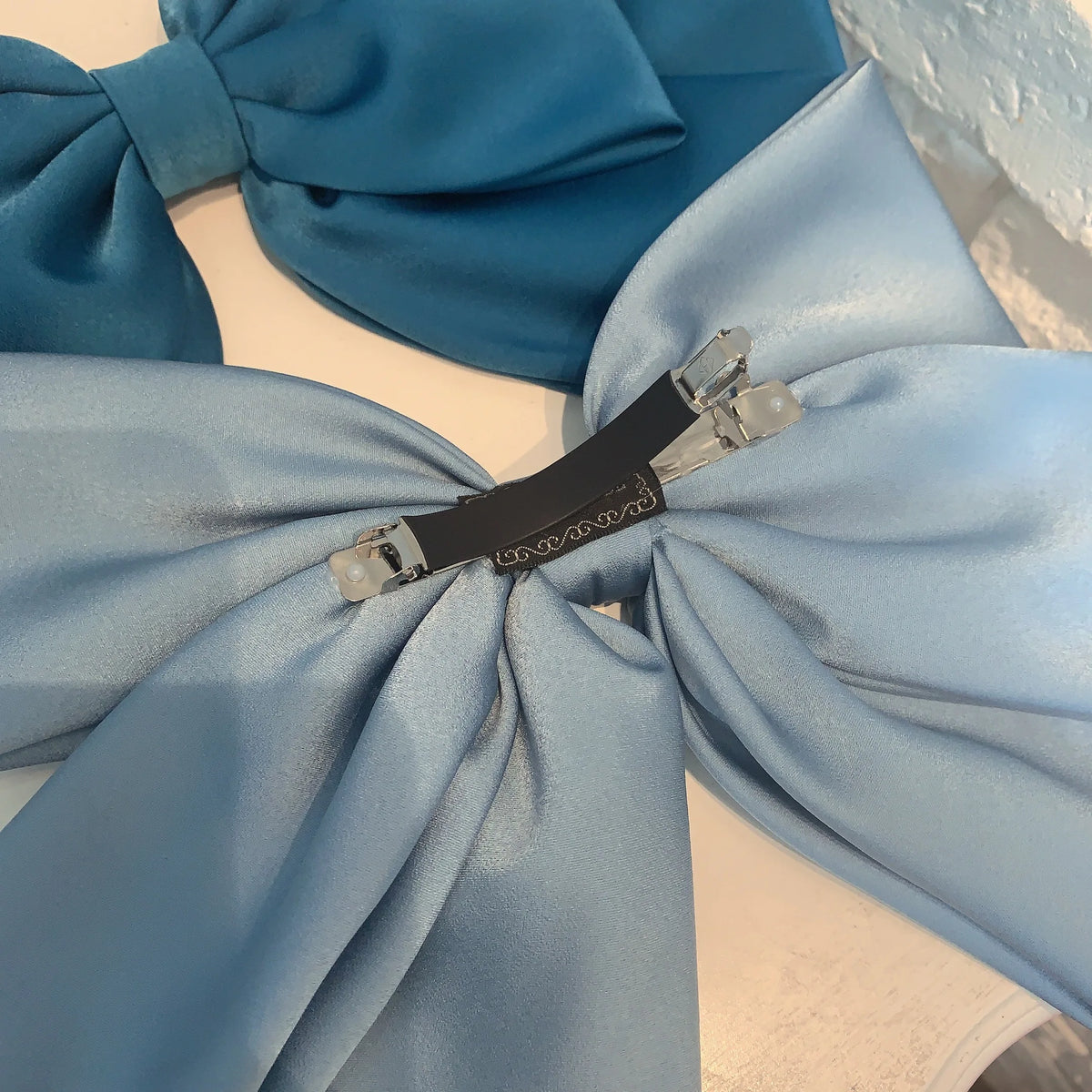 Premium satin bow hairpin for women by Hot Trend Vault, large retro hair clip perfect for ponytails and elegant hairstyles.