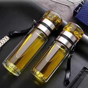 Hot Trend Vault reusable tea water bottle with glass infuser for adults, showcasing a sleek design and convenient infusing chamber.
