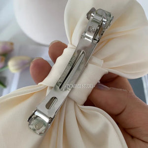 Elegant satin bow barrette hair clip by Hot Trend Vault with an oversized knot design, perfect for women's stylish hair accessories.