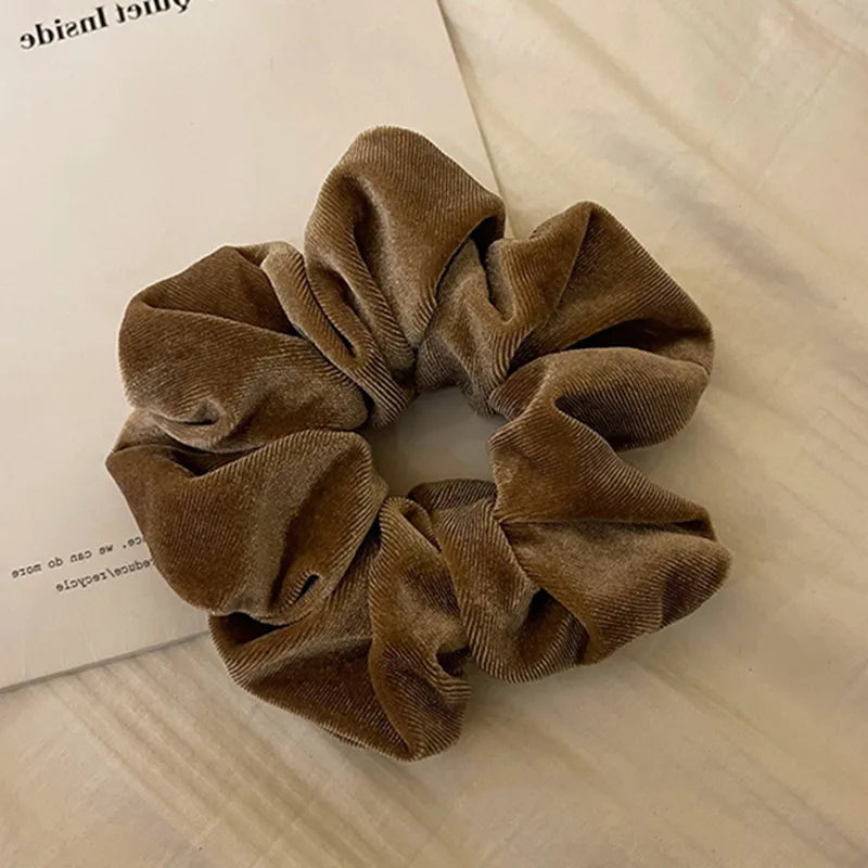 Hot Trend Vault velvet hair scrunchie for women, large elastic hair tie with soft cashmere texture, stylish hair accessory.