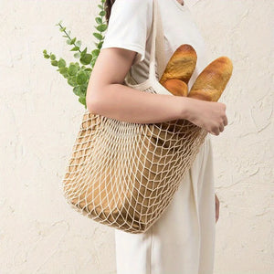 Reusable mesh grocery bag by Hot Trend Vault, washable eco-friendly shopping bag for eco-conscious shoppers, shown full of fresh produce.