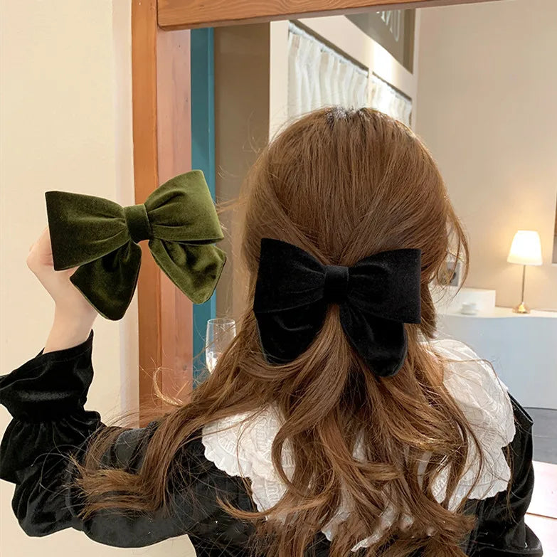 Elegant velvet hair clips with three-dimensional bowknot design for women and girls by Hot Trend Vault.