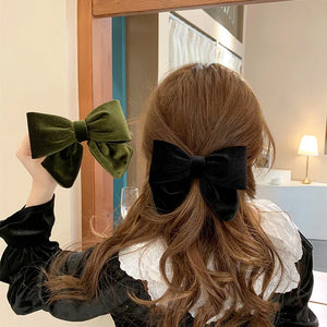 Elegant velvet hair clips with three-dimensional bowknot design for women and girls by Hot Trend Vault.