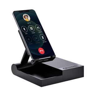 Hot Trend Vault DOSS wireless Bluetooth speaker with 15W charger and adjustable phone stand on a desk, showing sleek design and controls.