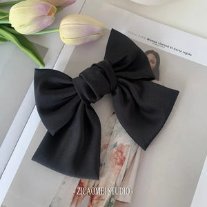 Elegant satin oversized bow knot hair clip by Hot Trend Vault, perfect for women’s stylish hair accessories.