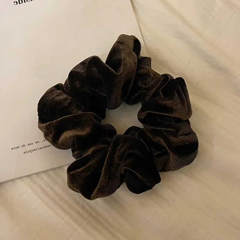 Hot Trend Vault velvet hair scrunchie for women, large elastic hair tie with soft cashmere texture and stylish accessory.