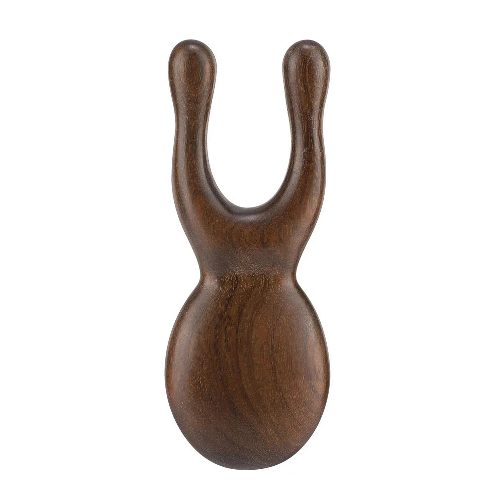Hot Trend Vault wooden Gua Sha facial tool made of sandalwood, used for face and neck massage to promote blood circulation.