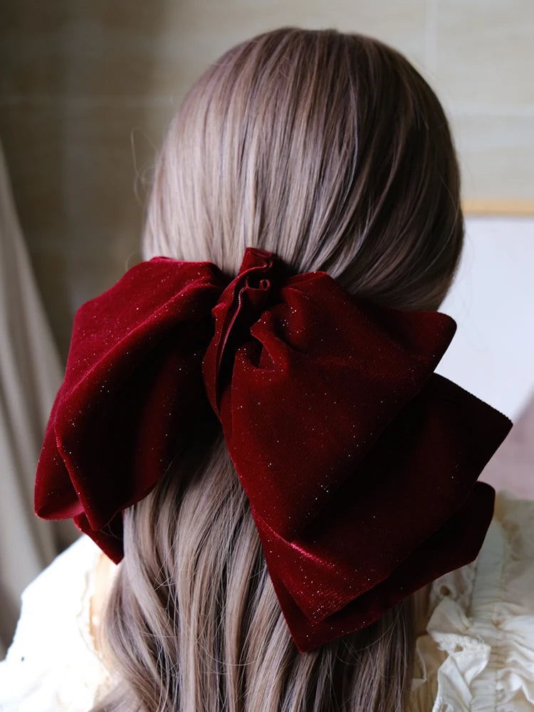 Velvet oversize bow hair clip for women and girls by Hot Trend Vault, featuring a stylish large bow design.