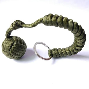 Outdoor self-defense umbrella rope kit with monkey fist steel ball, paracord key chain, designed for outdoor enthusiasts.