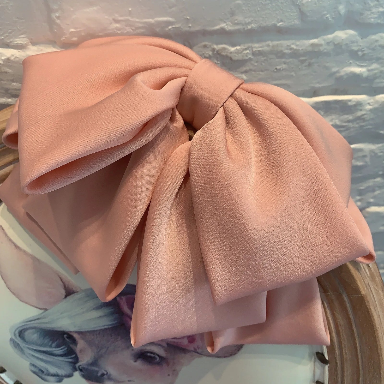 Premium satin bow hairpin by Hot Trend Vault, large retro hair clip perfect for ponytails and women's hair accessories.