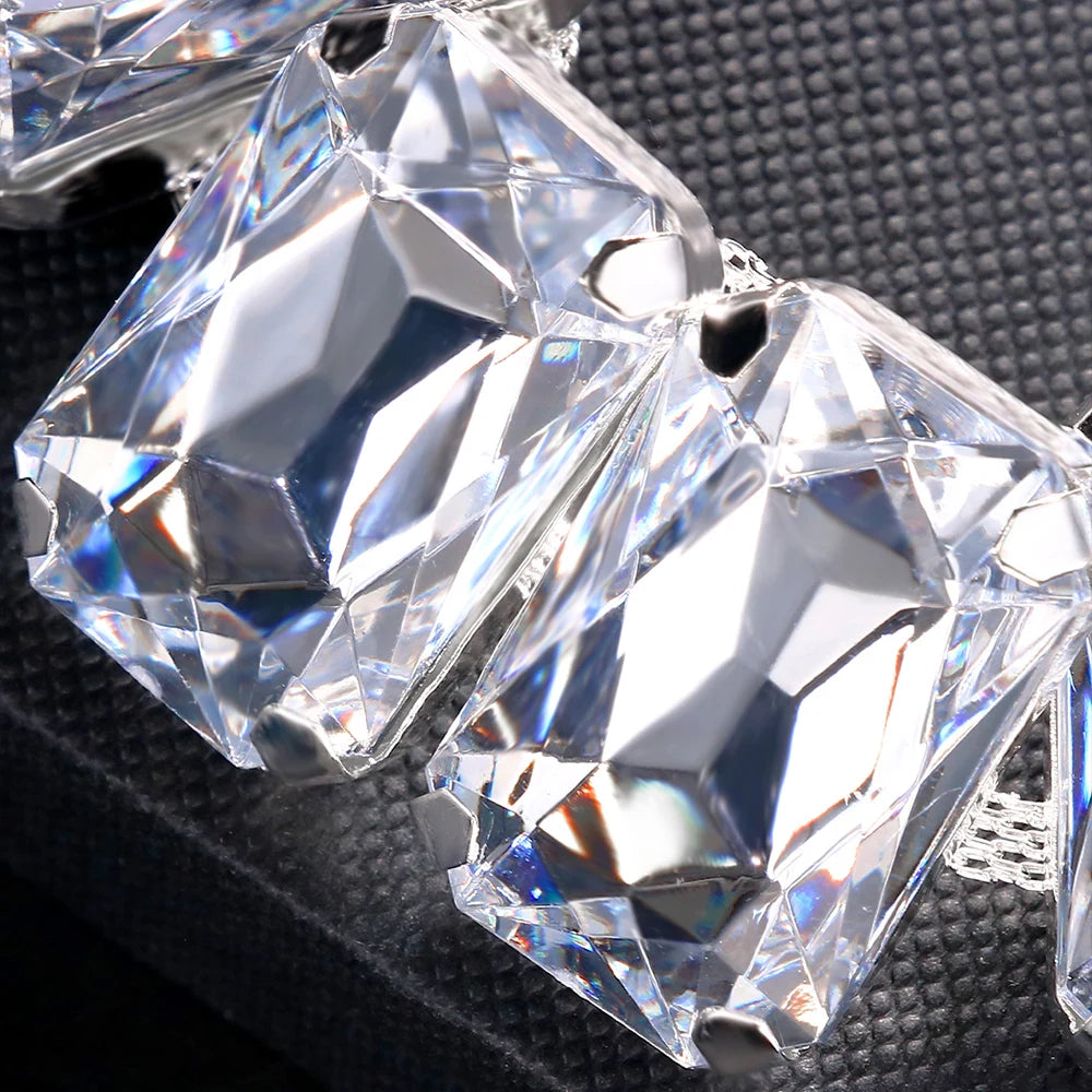 Luxury bridal jewelry set featuring Stone Fans geometric crystal necklace and earrings by Hot Trend Vault with sparkling details