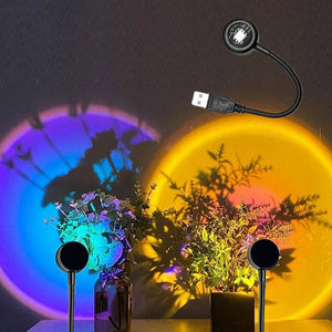 USB sunset light rainbow night lamp projector by Hot Trend Vault showing a colorful rainbow projection on a bedroom wall