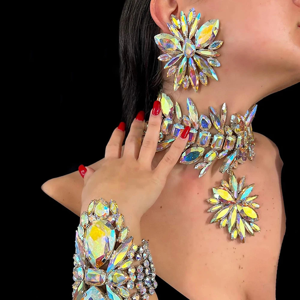 StoneFans rhinestone flower jewelry set for women and drag queens, includes necklace, earrings, and bracelet with sparkling floral design.