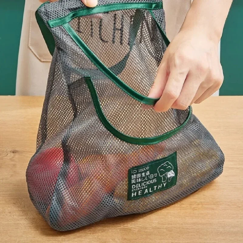 Reusable mesh storage bag from Hot Trend Vault, hanging net for onions, garlic, potatoes, ideal for kitchen organization.