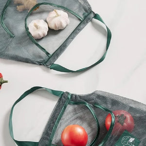 Reusable mesh storage bags by Hot Trend Vault for kitchen storage, hanging net bag for onions, garlic, and potatoes.