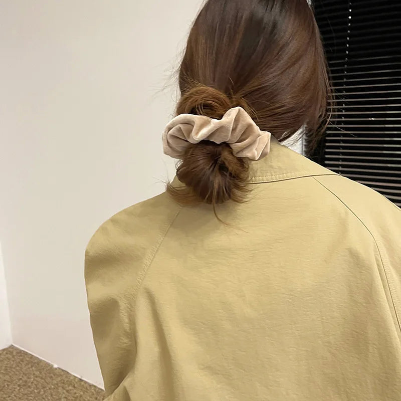 Hot Trend Vault velvet hair scrunchie for women, large elastic hair tie made of soft cashmere fabric, stylish hair accessory.