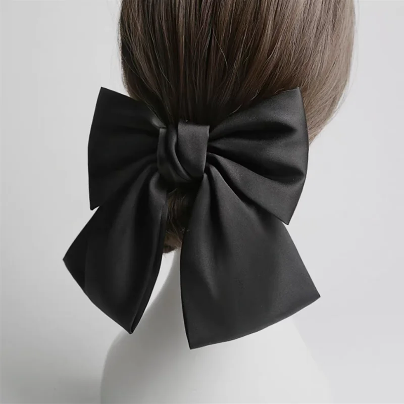 Elegant oversized satin bow barrette hair clip for women, featuring a knot design from Hot Trend Vault.