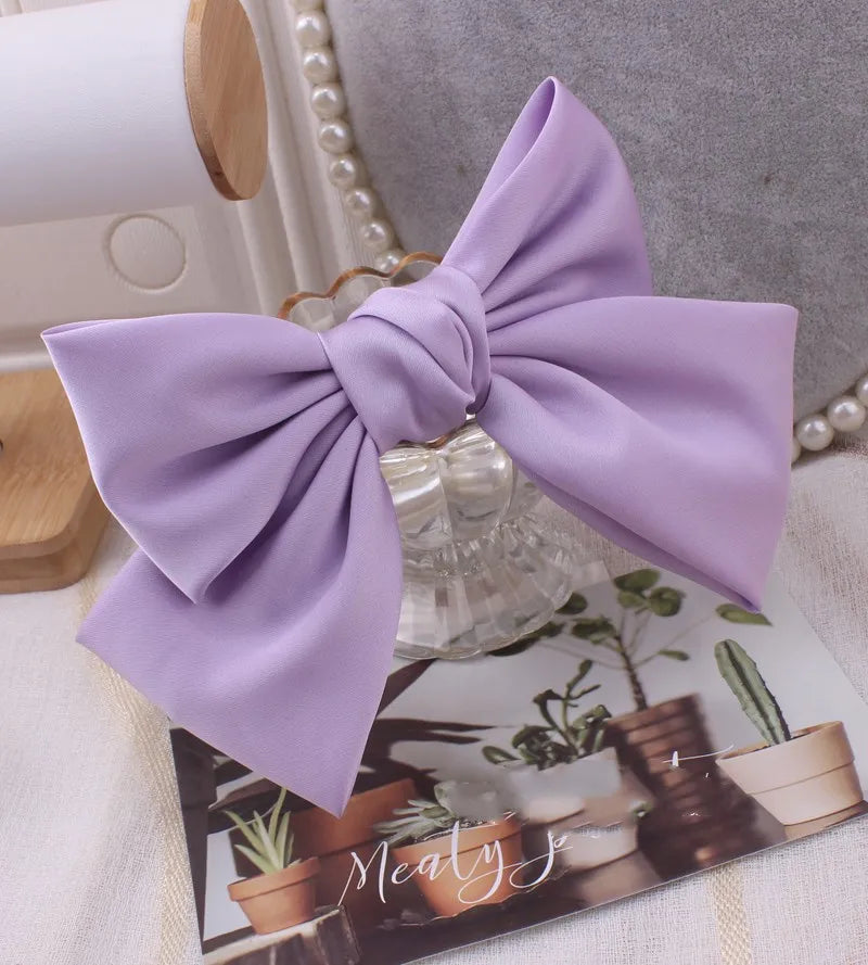 Hot Trend Vault satin bow barrette hair clip with oversized knot, elegant hair accessory for women, stylish hairgrip.