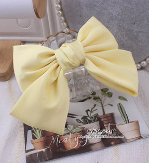 Oversized satin bow barrette hair clip for women with elegant knot design, from Hot Trend Vault, stylish hair accessory.