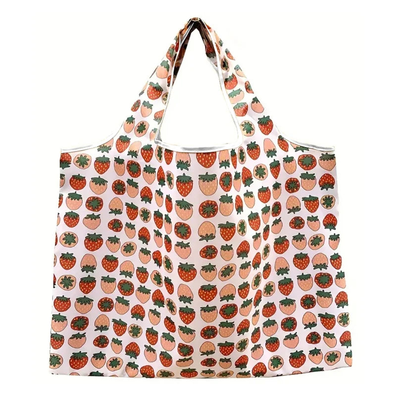 Reusable folding shopping bag by Hot Trend Vault with cartoon lemon and strawberry print, eco-friendly portable tote for shoppers.