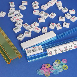 Set of four multicolor acrylic Mahjong tile pushers with rounded edges, used for organizing and handling Mahjong game tiles.