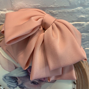 Large satin bow hairpin for women with retro style, featuring a classic design and elegant finish, perfect for stylish hair accessories.