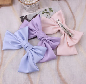 Oversized satin bow knot hair clip by Hot Trend Vault, elegant barrette accessory for women featuring a stylish, glossy finish.
